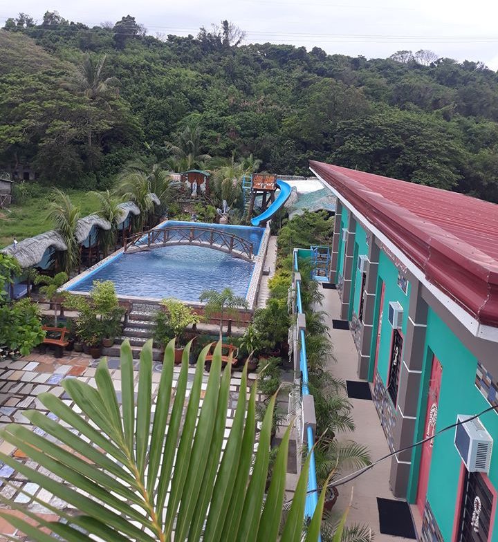 Top view of the resort's swimming pool, showing the pool bridge and water slide